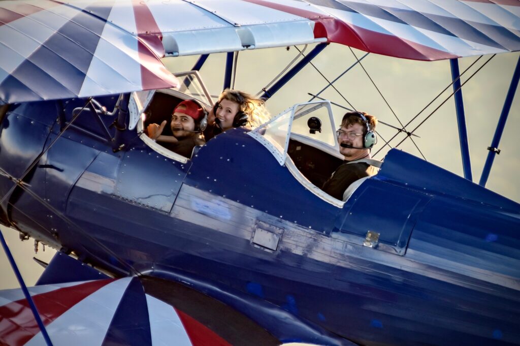 Couple enjoying a biplane flight